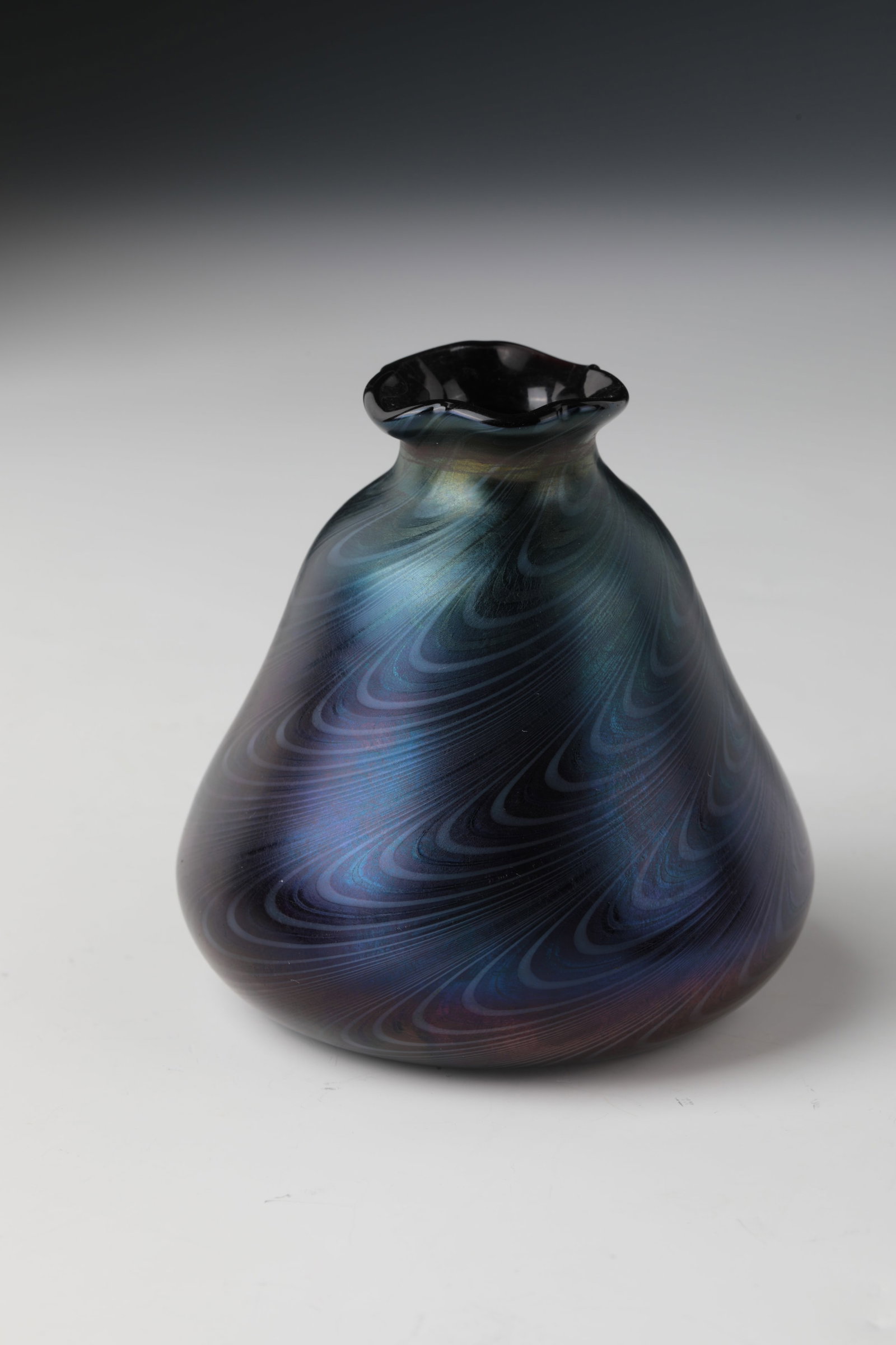 Small vase: Small vase Carl Schmoll von Eisenwerth (design), Ferdinand von Poschinger, Glashüttenwerke Buchenau, c. 1900 Black-violet glass with silver-yellow, wavy combed thread melting. Matt iridescent. Fi