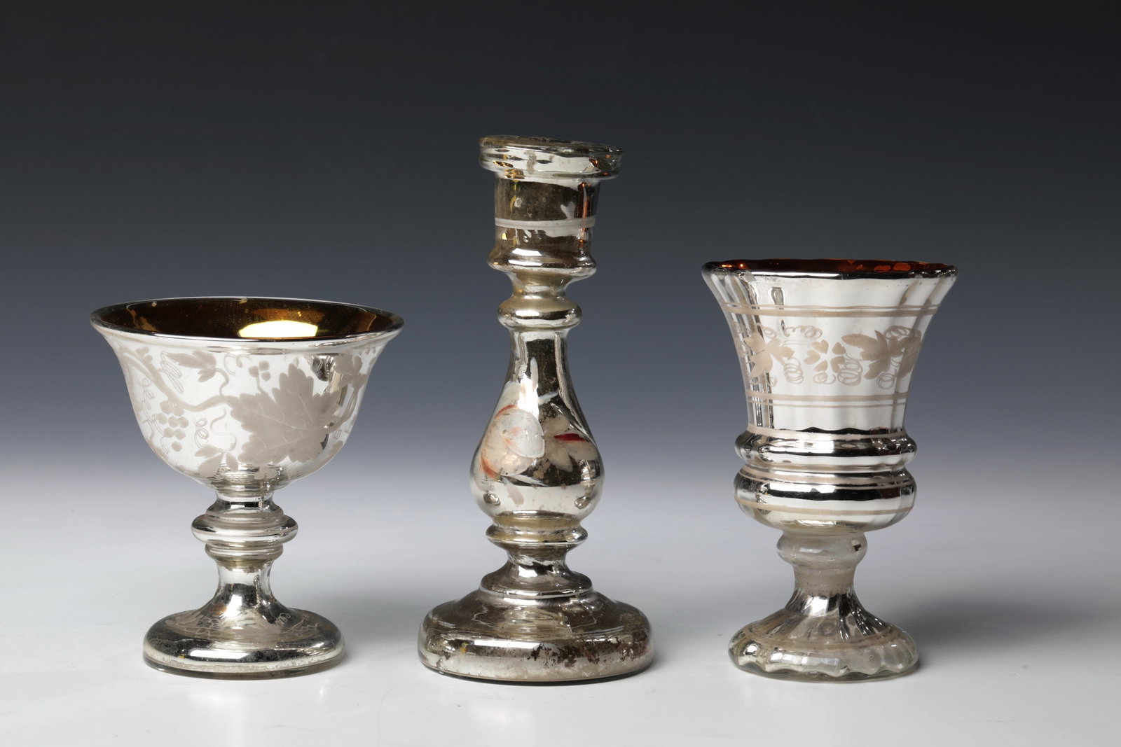 Foot cup, candlestick and foot bowl made of peasant silver: Foot cup, candlestick and foot bowl made of peasant silver Bohemia or Bavarian Forest, 2nd half of the 19th century. Vine tendril border in granulate technique (melted glass powder) or flowers in cold