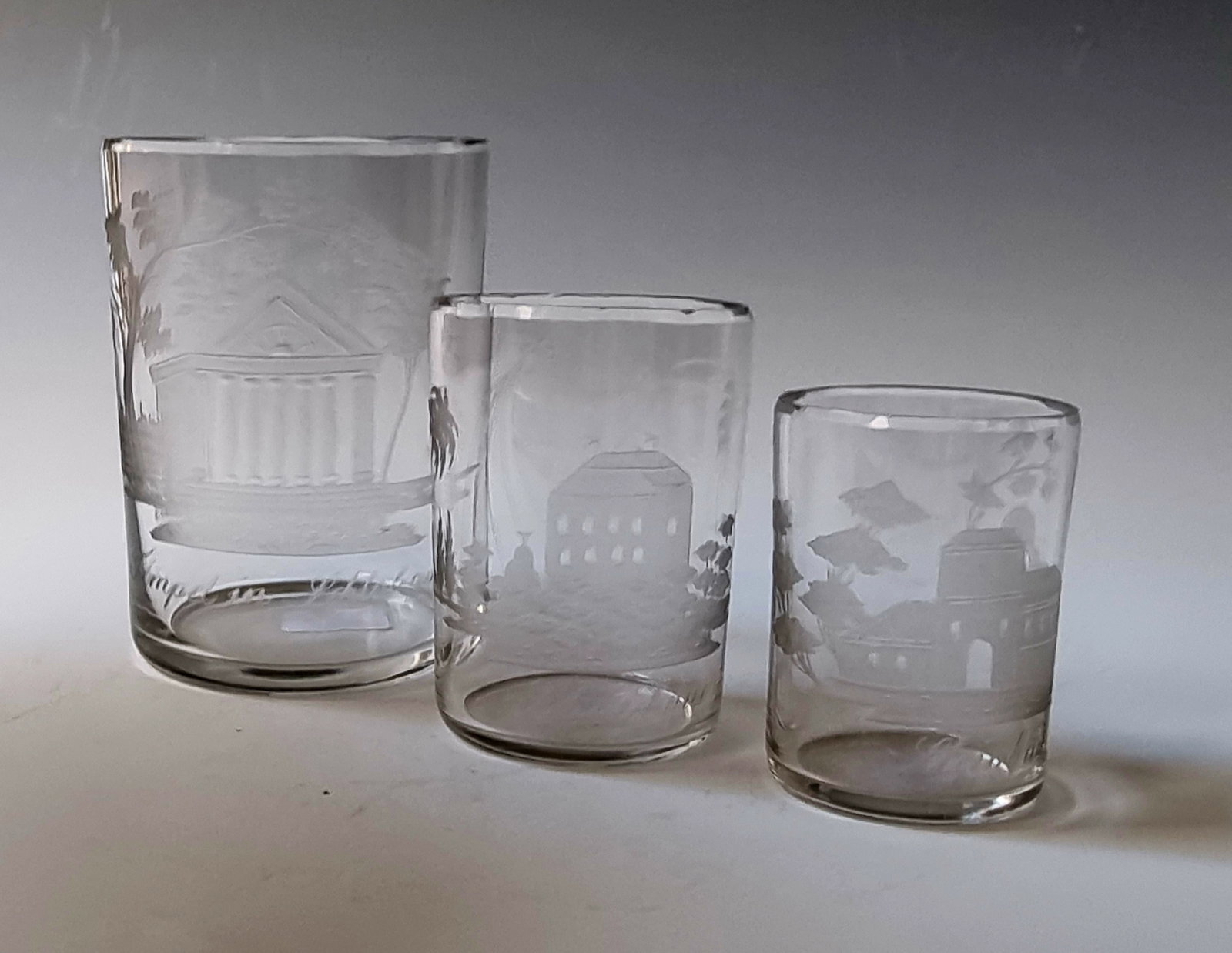 Three Mugs from Travel Set with Views of Teplice: Three cups from travel set with views of Teplice Bohemia, around 1820 On cylindrical walls each a cut, partly bleached, inscribed view of Teplitz: ''Temple in Castle Garden'',