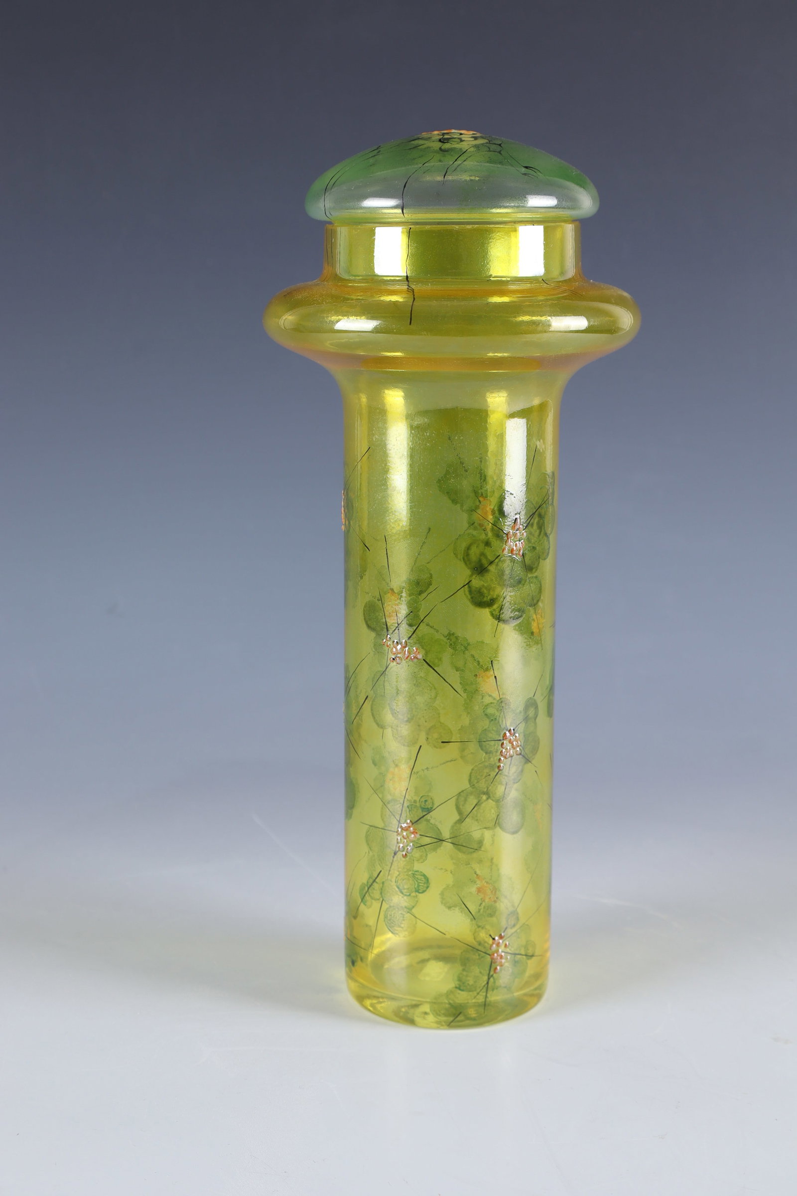 Lidded vase: Lidded vase Fachschule Steinschönau, Martina Dytrychova, no. 3439/2353, 2003 Colourless, yellow-glazed glass. On the cylindrical wall, which is compressed in the upper part, there is a stylized