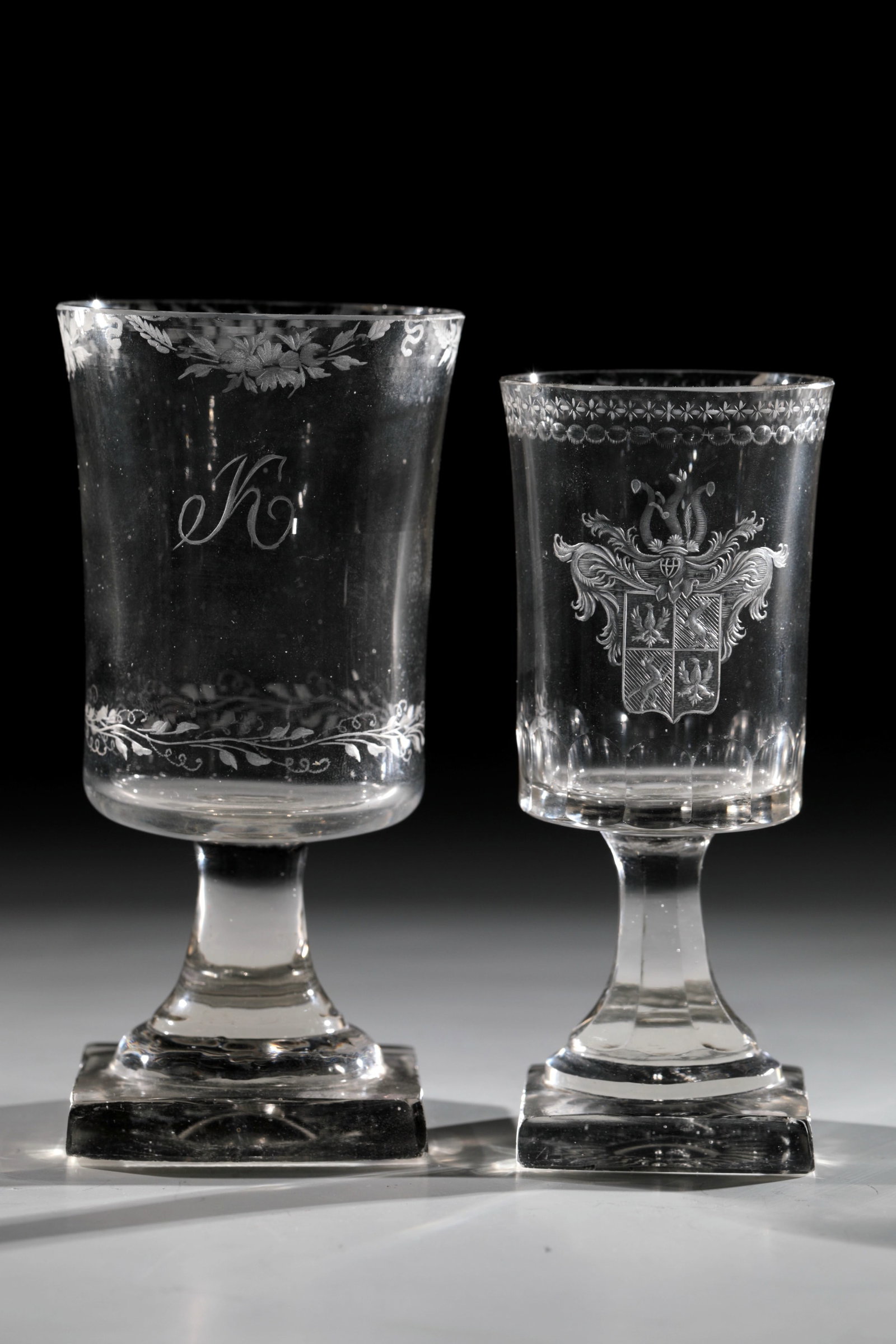 Two Empire Cups: Two Empire Cups Giant Mountains, around 1815 Colourless glass. Square plinth chipped with bottom ball. base and below the lip edge of the slightly protruding wall circumferential ornamental border.