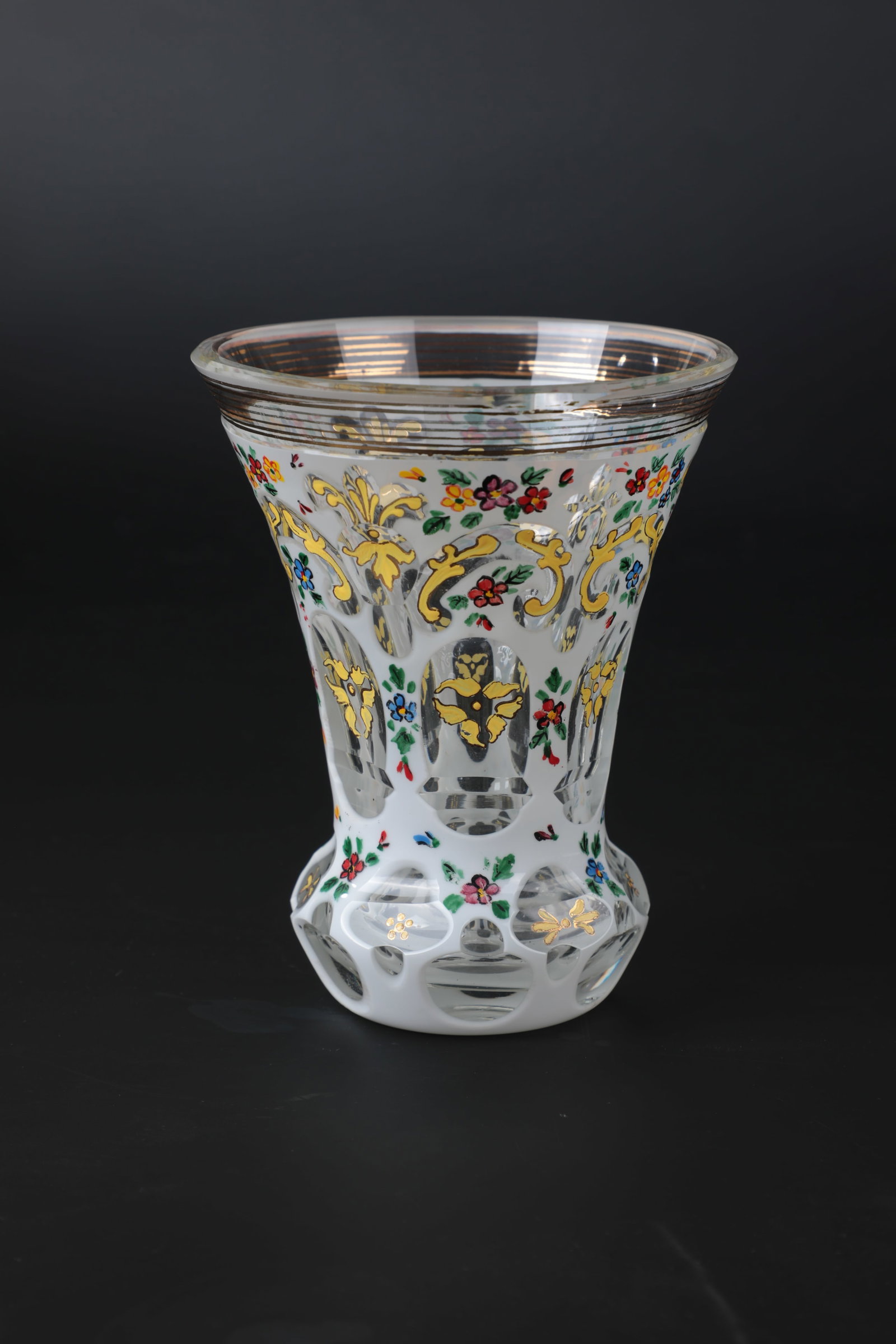 Mug: Mug after 1900 Colourless glass with tin enamel overlay and area-filling floral decoration in polychrome enamel painting. Contrasting lip edge sanded. H. 13.5 cm Becher nach 1900 Farbloses Glas mit