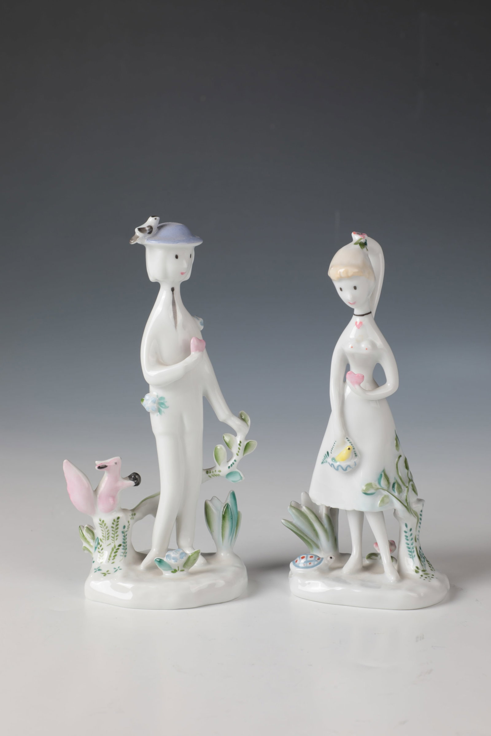 Girl and Cavalier with Heart: Girl and Cavalier with Heart Raymond Peynet (design), Rosenthal, after 1957 On an irregular natural pedestal with animals. Sparsely decorated in coloured on-glaze painting. Inscribed on the top of