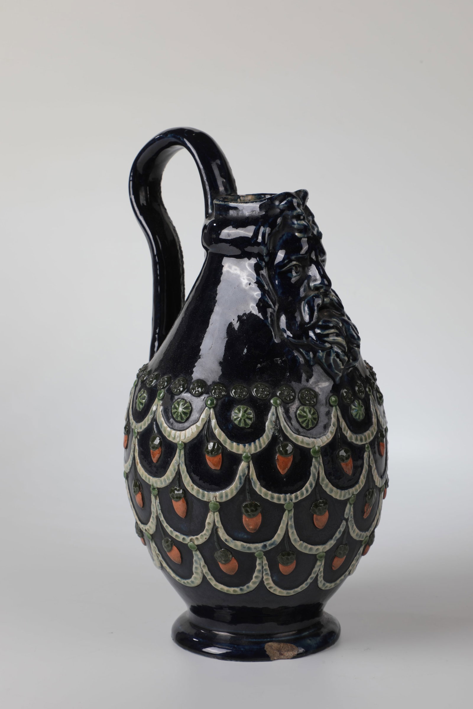 Bartmanskrug: Bartmanskrug In the style of the 16th century Heller Scherben. Below the spout is a three-dimensional depiction of a man with a beard. On the bulbous wall all around applied acorn, studded and