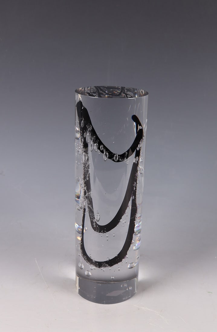 Object: Object Milan Krajícek Colourless glass. Fused black-violet glass décor and incorporated air bubbles. Signed in engraving above the stand: Milan Krajícek. Minimally bumped at the stand.