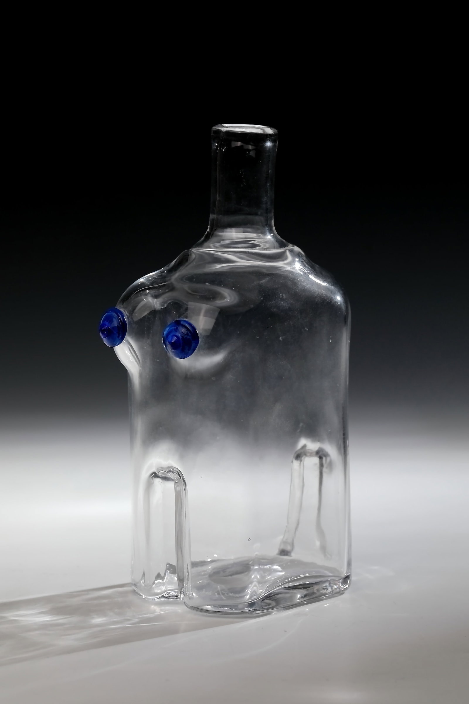 Carafe ''Lady'': Carafe ''Lady'' Boda, designed by Erik Höglund, 60th/70th years Colourless glass blown into a model with a polished tear-off and two cobalt blue applications. Inscribed and numbered illegibly in