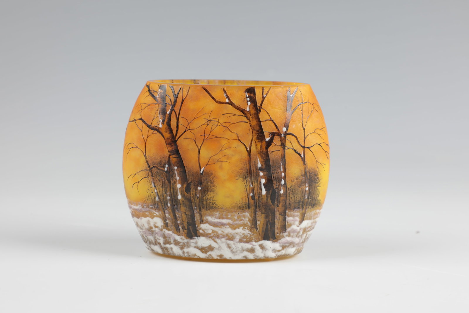 Vase ''Paysage d'hiver'': Vase ''Paysage d'hiver'' Daum Fréres, Nancy, around 1902 Colourless glass, orange and lemon yellow powder inclusions. Flat relief etched, colourfully enamelled décor: wintry tree landscape i