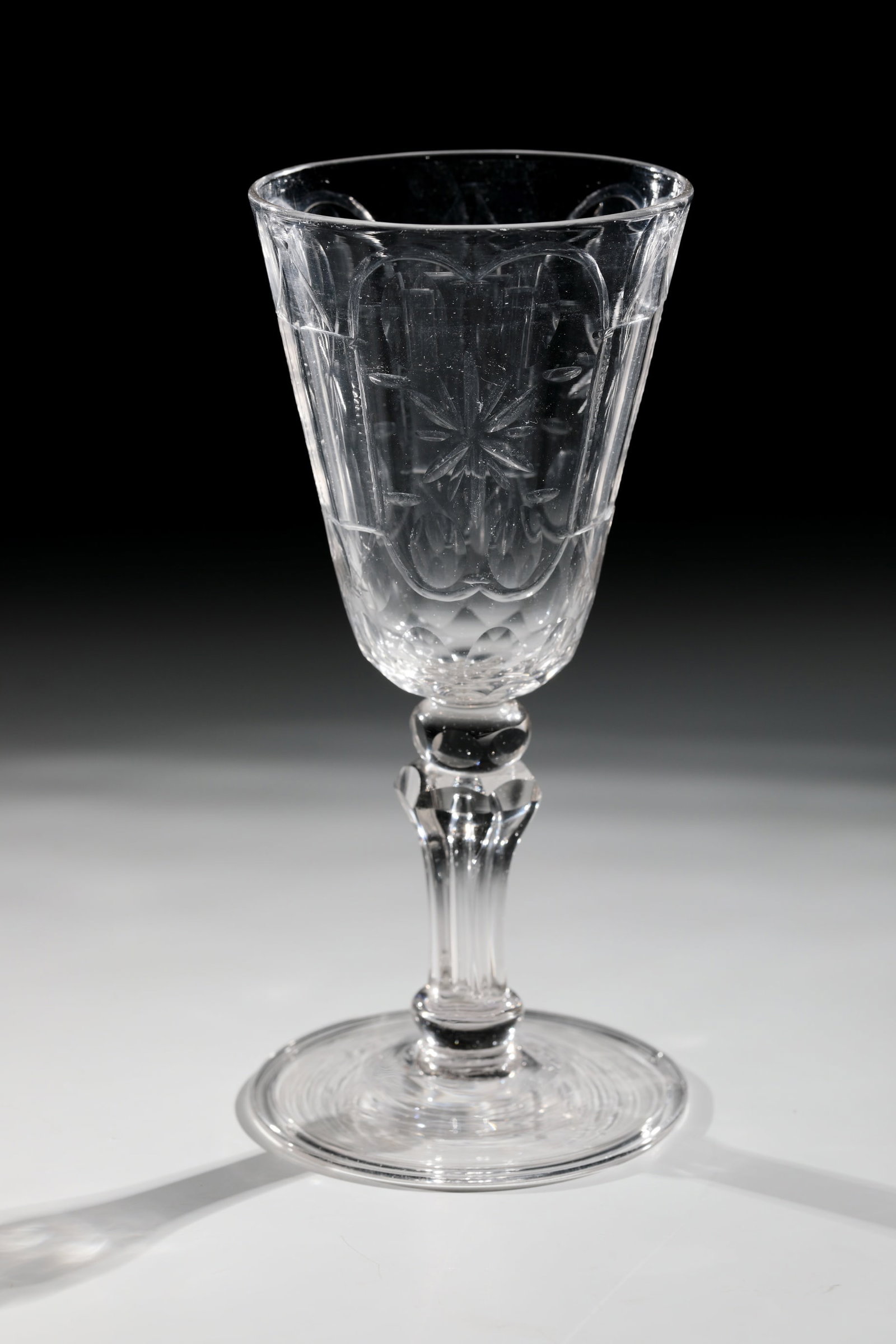 Cup: Cup Middle German, 18th century Colourless glass with tear-off. Disc base with the edge folded downwards. Faceted baluster shaft with pierced air column and pressed ball nodus. Conically widened