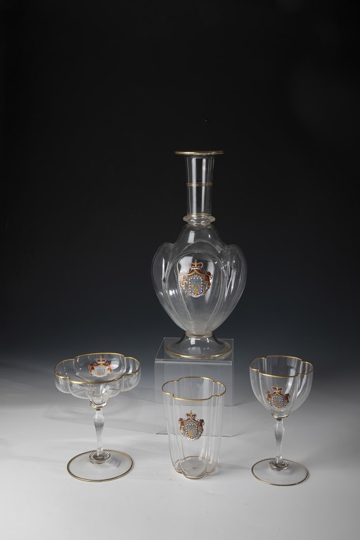 Four parts of a drinking service: Four parts of a drinking service J.&L. Lobmeyr, Vienna, late 19th century Consisting of: carafe, water and wine glass and champagne bowl. Colorless glass. On the cross-sectional quadrupron bodies