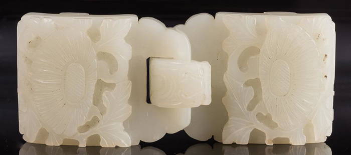 Chinese Celadon Jade Double Belt Buckle: Chinese pale celadon jade double belt buckle, carved with lotus flower motif, chilong dragon hook. 4 1/2" L. Late 19th century. Provenance: Private West Tennessee collection. (Additional high-resoluti