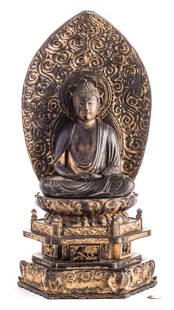 Japanese Zushi Buddha Altar Shrine: A large Japanese Zushi lacquered and gilt carved wooden Buddha altar shrine. Comprised of three parts including the seated figure, the curved arched plaque with scrollwork and sun motif and the