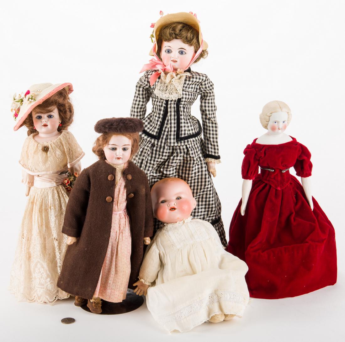 Group of 5 dolls: Group of five (5) dolls. 1st item: Parian head doll with blonde molded sausage curls, center part, blue painted eyes and features, Parian limbs with molded hands and painted shoes; muslin undergarment