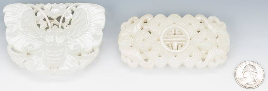 2 Chinese White/Pale Celadon Carved Belt Buckles: 1st item: Chinese carved and pierced white/pale celadon belt ornament, carved in the form of a butterfly with carved flower head hooks. 2 1/2" H x 3 1/4" W. 2nd item: Chinese carved and pierced