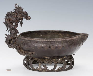 Chinese Bronze Ritual Pouring Vessel: Chinese bronze ritual pouring vessel, bowl form, having a detailed figural dragon handle and low relief decoration to the body including yunwen or key fret pattern decoration to the rim, engraved