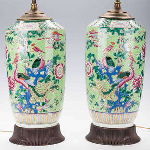 Pr. Chinese Porcelain Famille Verte Vases Mounted as: Pair of Chinese export Famille Verte rouleau form vases mounted as lamps, having landscape decoration including blossoming prunus branch and chrysanthemum with various birds. Mounted on carved wood