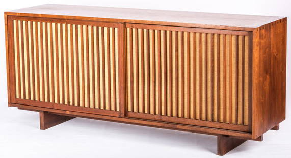 George Nakashima Walnut Credenza: George Nakashima (Pennsylvania/Washington/Japan/India, 1905-1990) mid-century modern walnut credenza, pinned and dovetailed case construction with two vertical slat sliding doors backed with pandanus