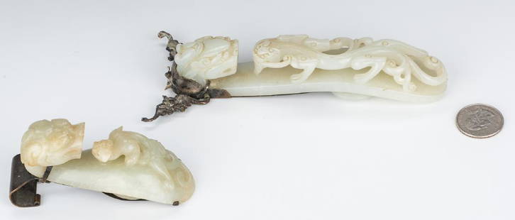 2 Chinese White Jade Buckles w/ Metal Mounts: 1st item: Large Chinese carved buckle or mirror handle with intricately carved dragon head top and reticulated carved chilong dragon figure to the body. Retains floral engraved and bat mirror mounts