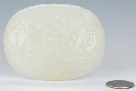 Carved Oval Chinese White Jade Buckle: Carved Chinese white jade buckle, oval form with carved chrysanthemum and scrolling leaf design to the front, carved chilong dragon hook and carved rosette hook to the back. 2 3/4" H x 3 1/2" W. Late