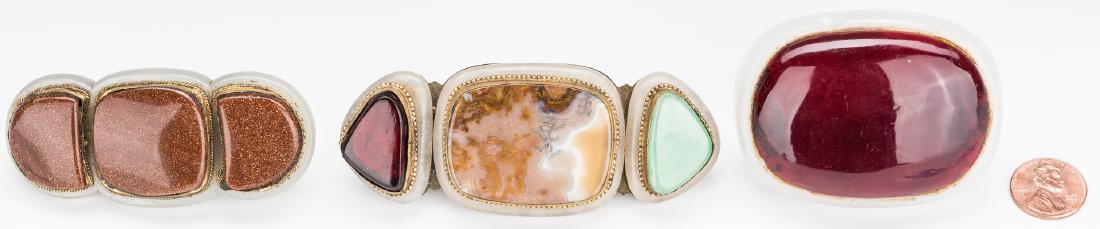 3 Chinese Jade, Stone & Gilt Bronze Buckles: Three (3) Chinese hardstone, jade and gilt bronze belt ornaments, including one with three shaped goldstones mounted onto a white jade base and inset into a gilt and foliate engraved bronze base (1