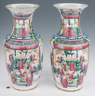 Pair of Qing Famille Rose Vases: Pair of Chinese Qing Dynasty Famille Rose Vases, baluster form with flared neck and Foo Dog mask handles, each enameled with scenes of a figures celebrating with a parade on one side, and a temple
