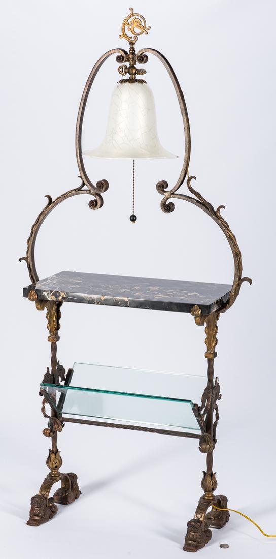 Reading Table, Oscar Bach label: Labeled Oscar Bach library or reading table, comprised of gilt patinated wrought iron and glass. Dragon head finial over a white art glass bell form shaped shade, centered and supported by scrolling f