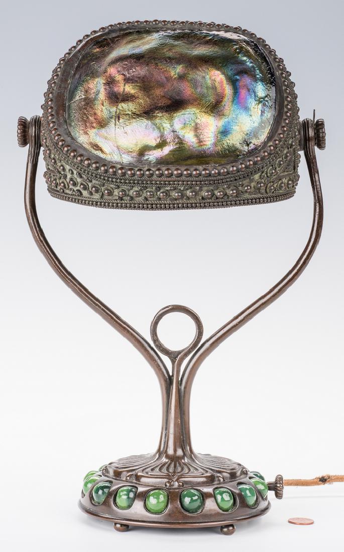 Tiffany Studios Turtleback Desk Lamp: Tiffany Studios "turtleback" table or desk lamp, comprised of two favrile turtleback panels of green, gold, brown and blue iridescent glass, in a verdigris bronze frame with rope and bead decoration o