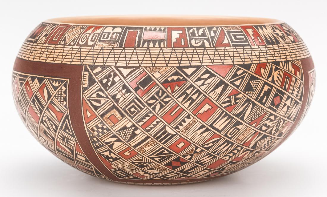 Rondina Huma Hopi Pottery Bowl: Rondina Huma (Hopi, b. 1947) pottery bowl with intricate polychrome geometic decoration. Signed on the base in faded script "Rondina Huma/Tewa Village/Polacca, AZ". 3 1/4" H x 6 1/2" dia. 20th century