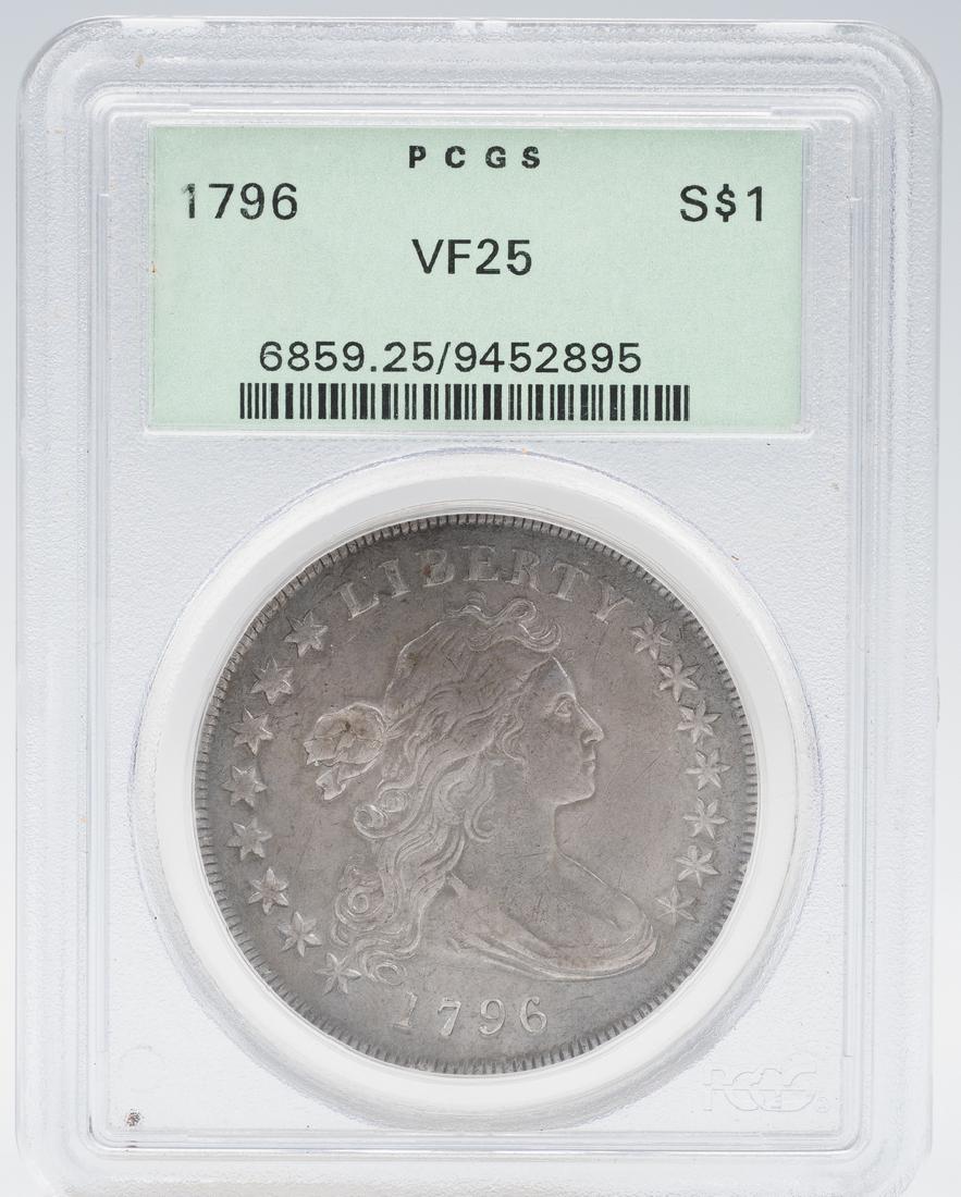 1796 US Draped Bust Silver Dollar Coin: 1796 United States Draped Bust silver dollar coin. Depicts the bust of Lady Liberty, obverse, and the American bald eagle encircled by a laurel wreath, reverse. PCGS graded 25/Very Fine. Note: While t