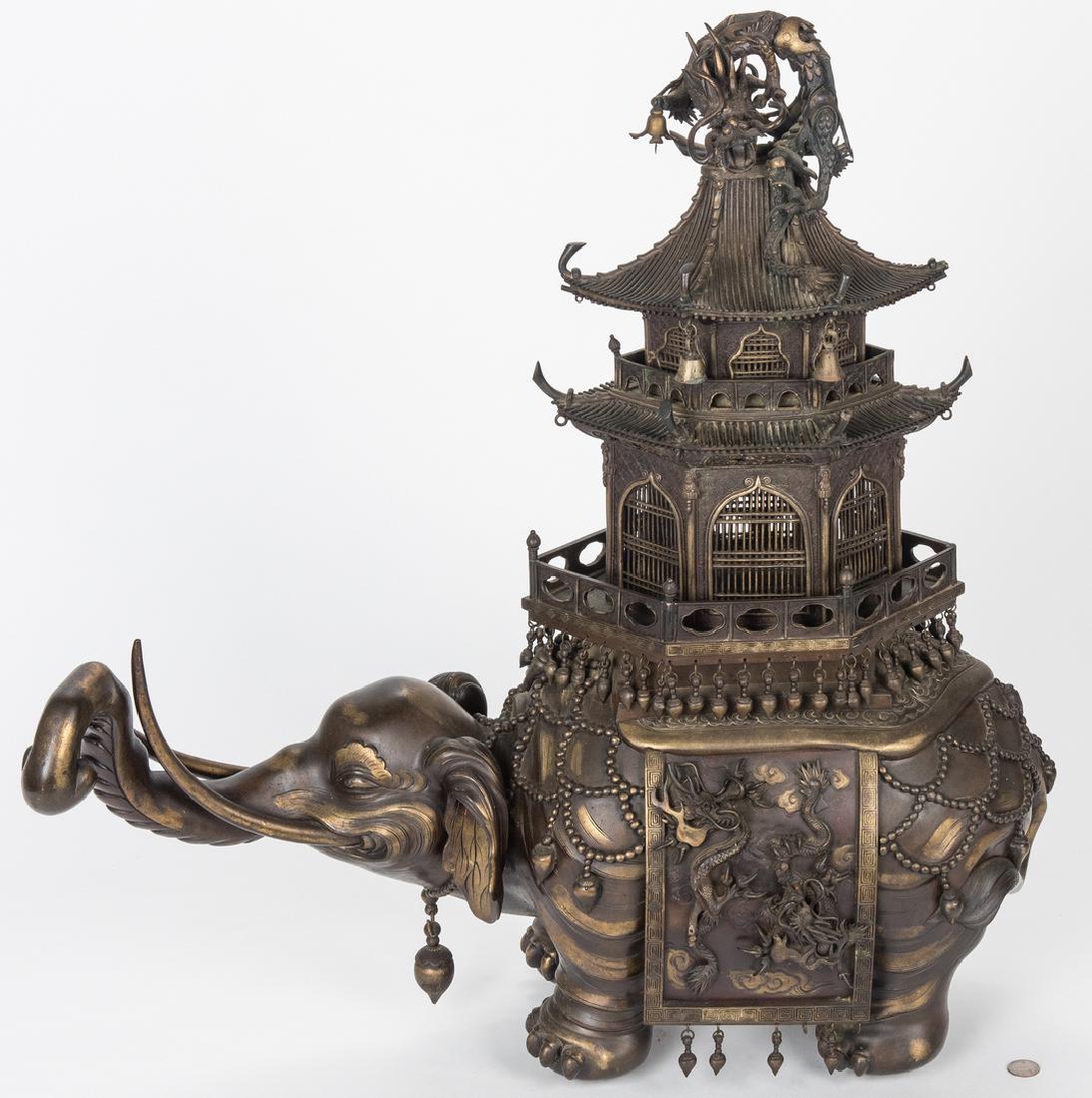Japanese Bronze Elephant Pagoda Incense Burner: Large Meiji Japanese gilt and patinated bronze elephant pagoda incense burner, comprised of an elephant having a raised trunk with a two part pagoda atop its back, the pagoda surmounted by a dragon. 3