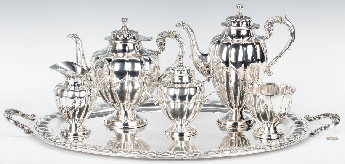 6 pc. Mexican Sterling Tea Set w/ Sterling Tray: Mexican sterling silver tea and coffee service, six (6) pieces including coffee pot, tea pot, creamer, sugar bowl, waste bowl, and double handled tray. Each hollowware piece with lobed body, scrolled