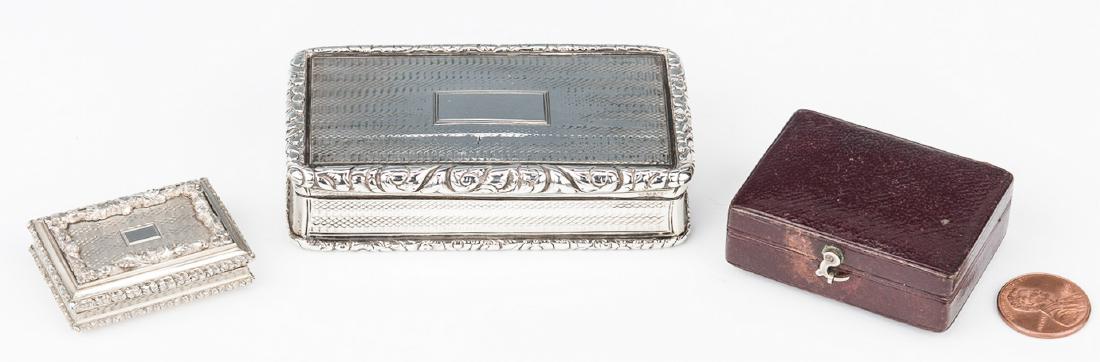 Nathaniel Mills Vinaigrette and Snuff Box: Two (2) small sterling boxes. 1st item: Victorian sterling silver vinaigrette, engine turned with applied floral border, vacant central monogram reserve, elaborate pierced interior grille, gilded inte