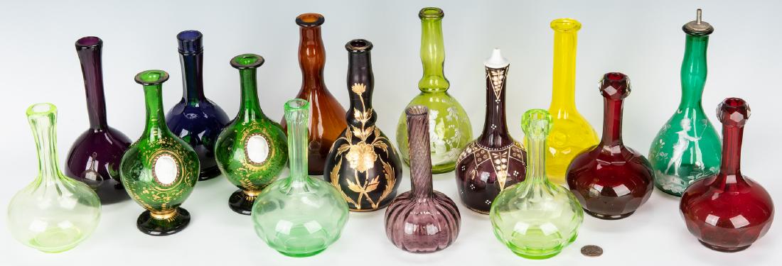 16 Assorted Glass Barber Bottles, incl. Mary Gregory: Group of sixteen (16) assorted glass barber bottles including two (2) Mary Gregory examples (turquoise & green), two (2) green Czech or Bohemian glass examples with applied cameos, two (2) cranberry g