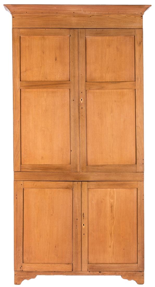 Middle TN Butternut Corner Cupboard: Middle Tennessee, Davidson County, corner cupboard, butternut primary and poplar secondary wood. Single case, mortise and tenon construction. Ogee cornice, straight-back side returns, paneled doors wi