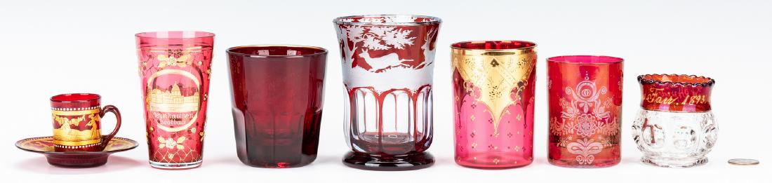 7 Pcs. of Ruby Glass, Art & World's Fair: Seven (7) Pieces of Ruby Glass, Art & World's Fair. 1st item: Cranberry cut to clear Bohemian glass tumbler with engraved forest scene depicting a dog hunting a deer and stag. 4 1/2" H. Late 19th cent