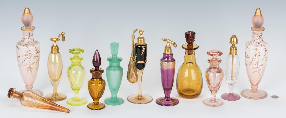 12 Art Deco Perfume Bottles & Vases, incl.: Assortment of twelve (12) Art Deco perfume bottles including one (1) Czechoslovakian amethyst glass atomizer with gilt decorative band, intaglio floral design, and brass top, stamped "Czechoslovakia" 