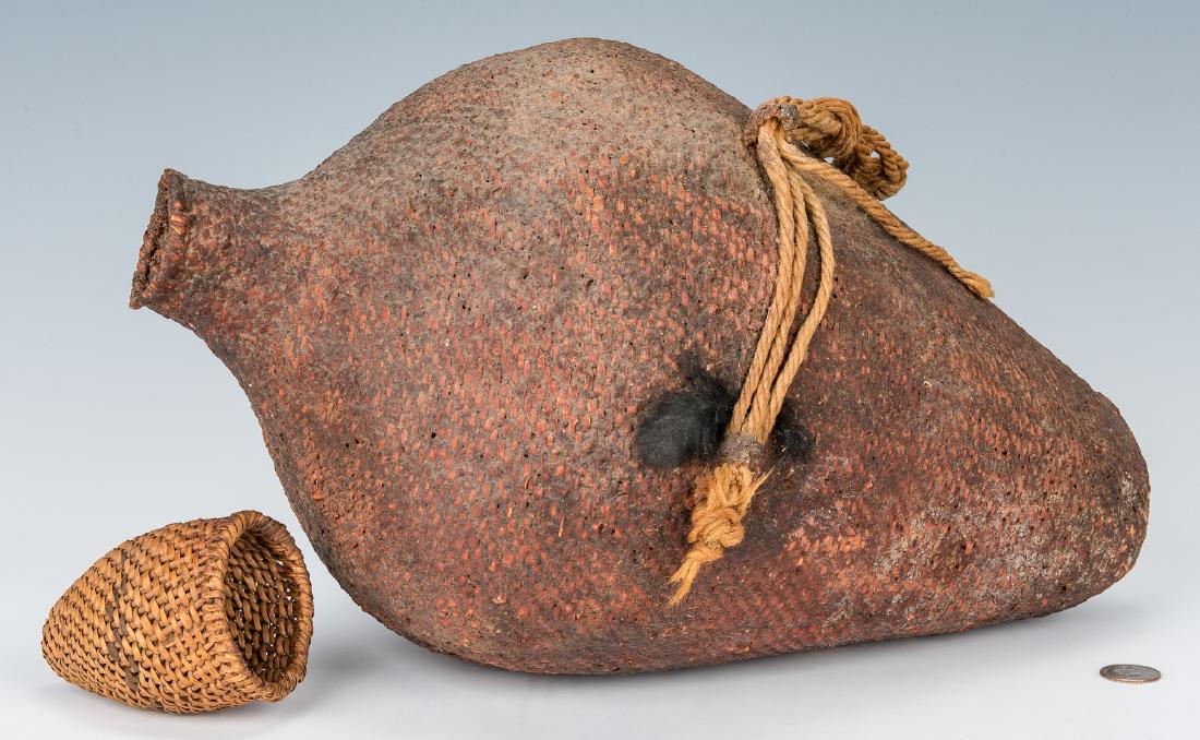 2 Native American Paiute Baskets, incl. Water Basket: Two (2) Native American Paiute (Northwest Coast) Baskets. 1st item: Paiute traditional coiled willow or sumac water basket with pitch and clay coating, two loop handles, and carrying cord. 17 1/4" H.