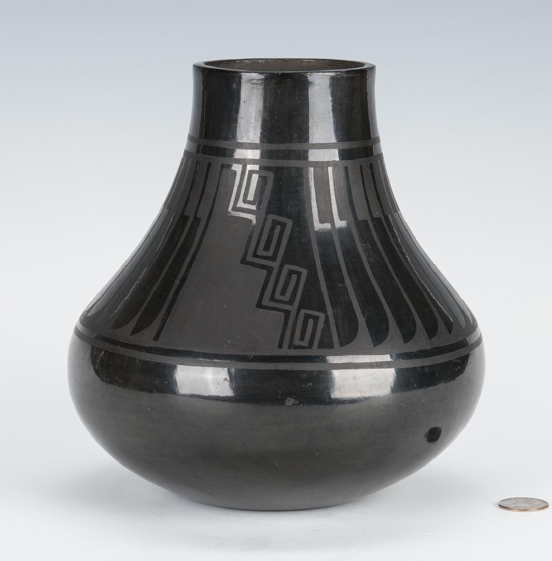 Large San Ildefonso Pottery Jar, Blue Corn: Large Native American San Ildefonso black on black pottery jar by Crucita Gonzales Calabaza (1921-1999) with stylized feather and geometric designs to the body. Signed on the base "Blue Corn/San Ildef