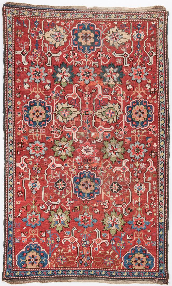 Antique Kuba East Caucasus area rug: Kuba Caucasian area rug, 70" x 43-1/4" overall, russet/red field, allover pattern, colors of green, blues, ivory, salmon, yellow, black and taupe. Late 19th century. Provenance: the collection of Mr. 
