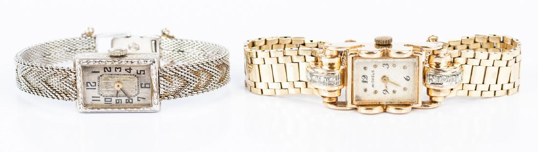 2 Vintage 14K Lady's Watches: Two (2) vintage 14K lady's wrist watches. 1st item: 14K yellow gold and diamond Retro style bracelet wrist watch by Michele with rectangular face with scroll frame, 6 round diamonds in rolled step-dow