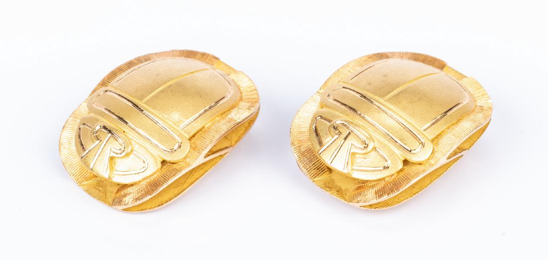Pair 18K Two-Tone Scarab Earrings: Pair of 18K two-tone yellow and rose bright and satin gold scarab beetle figure clip-on earrings. Each with Egyptian hallmark for 18K. 1" x 5/8" with clip-back for non-pierced ears. 18.6 grams. Proven