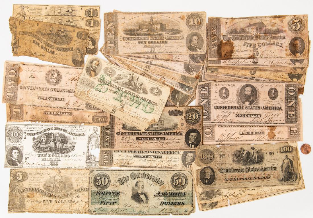 33 Mixed Confederate Bills, incl. $100, $50: Group of Thirty-Three (33) Confederate States of America (CSA) Bills. 1st item: One (1) $100 bill, Series unspecified, issued in Richmond, VA, October 18, 1862, printed by J. T. Paterson & Co., Columb