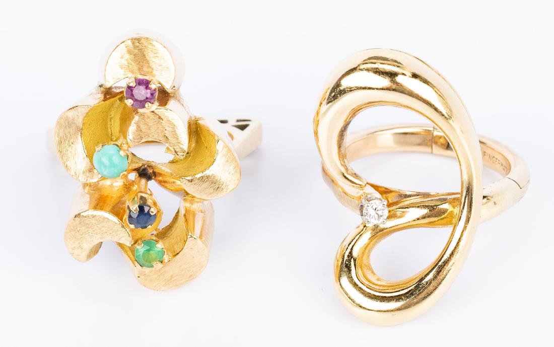 2 Gold Fashion Rings, 18K and 14K: Two (2) Gold Fashion Rings. 1st item: 18K yellow gold modern design satin and bright gold ring with four assorted round natural gemstones. Marked FAE, 18K on inside. 1-1/16" H top. Ring size: 6-1/2. 1