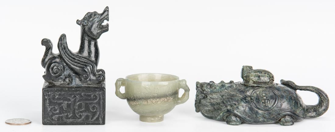 Jade double handle cup, water dropper and seal: Three (3) Chinese Jade and Archaic Style Hardstone items, including a cup, water dropper and seal. 1st item: Ming style footed circular jade cup with two carved branch style handles, extending from a