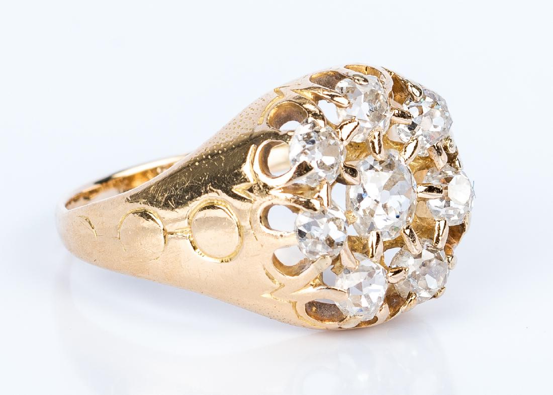 Vintage 14K Yellow Gold Diamond Ring: Vintage 14K yellow gold diamond ring containing 8 old mine cut diamonds set with a center stone surrounded by 7 stones, with a total weight of approximately 1.35 ct. and approximately K-L color, SI-I