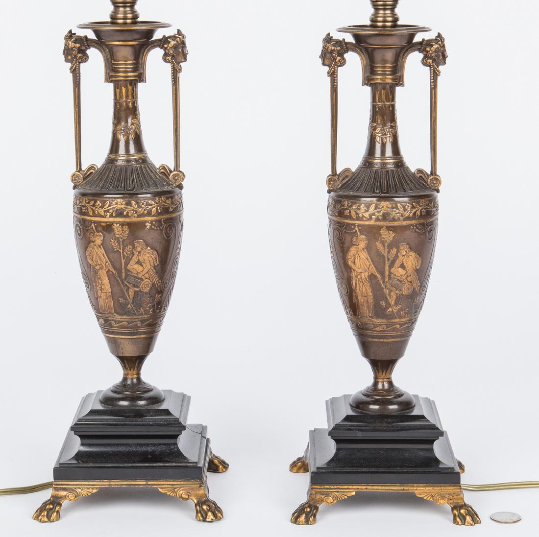 Pair of Barbedienne Bronze Lamps: Pair of French bronze lamps, formed as amphora with classical mask and bas relief decoration, foundry mark F. Barbedienne (Ferdinand Barbedienne, French, 1810-1892), signed Henry Cahieux (Sculptor, Fr