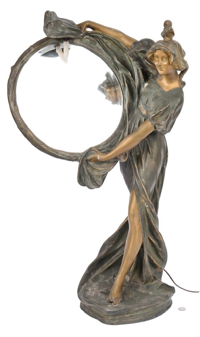 Art Nouveau Mirrored Table Lamp: Art Nouveau bronzed metal figural table lamp, designed in the form of a beautiful young woman holding a round beveled mirror with one light socket. Naturalistic base signed "A.Barsoty(?)". 32 1/2" H x