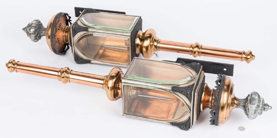 Pair 19th Century Lanterns, Nashville history: Pair of 19th century copper, silver metal, tole painted and wrought iron carriage or coach lamps with ornate finials, arched beveled glass and swag decoration along the rounded tops, both retain the o