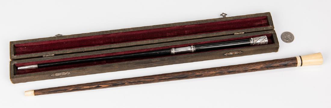 2 Orchestra Conductor Batons, 1 w/ case: Two (2) Orchestra Conductor Batons. 1st item: English sterling mounted ebonized wood conductor's orchestra baton, housed in the original velvet lined case. Baton - 17 1/4" L. Case - 18 5/8" L. Early 2