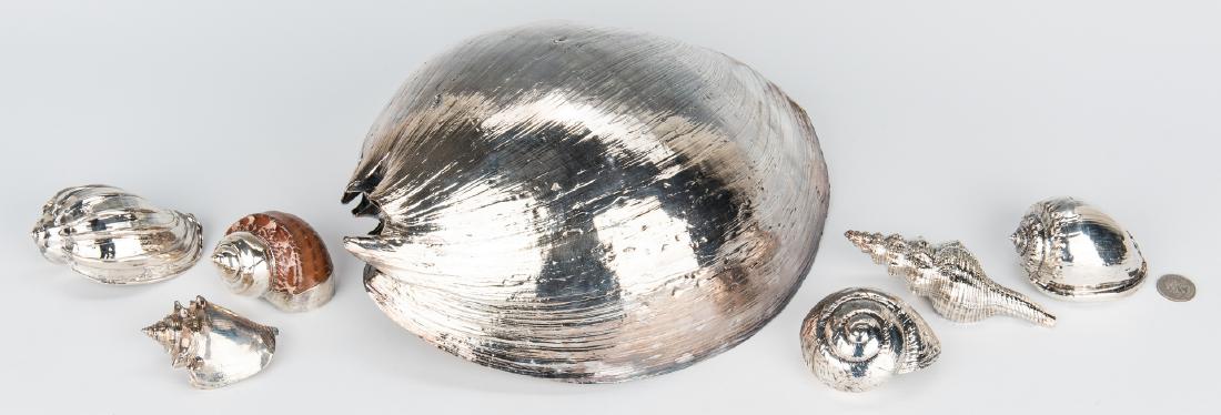 7 Silver Clad Seashells, incl. Ruzzetti & Gow: Seven (7) Italian Silver Clad Seashells, including Ruzzetti & Gow. 1st item: Large Laminato AG silver clad Melon Seashell. Maker's stamps with "925", underside of shell. 5 1/8" H x 10" W x 13" L. 2nd-
