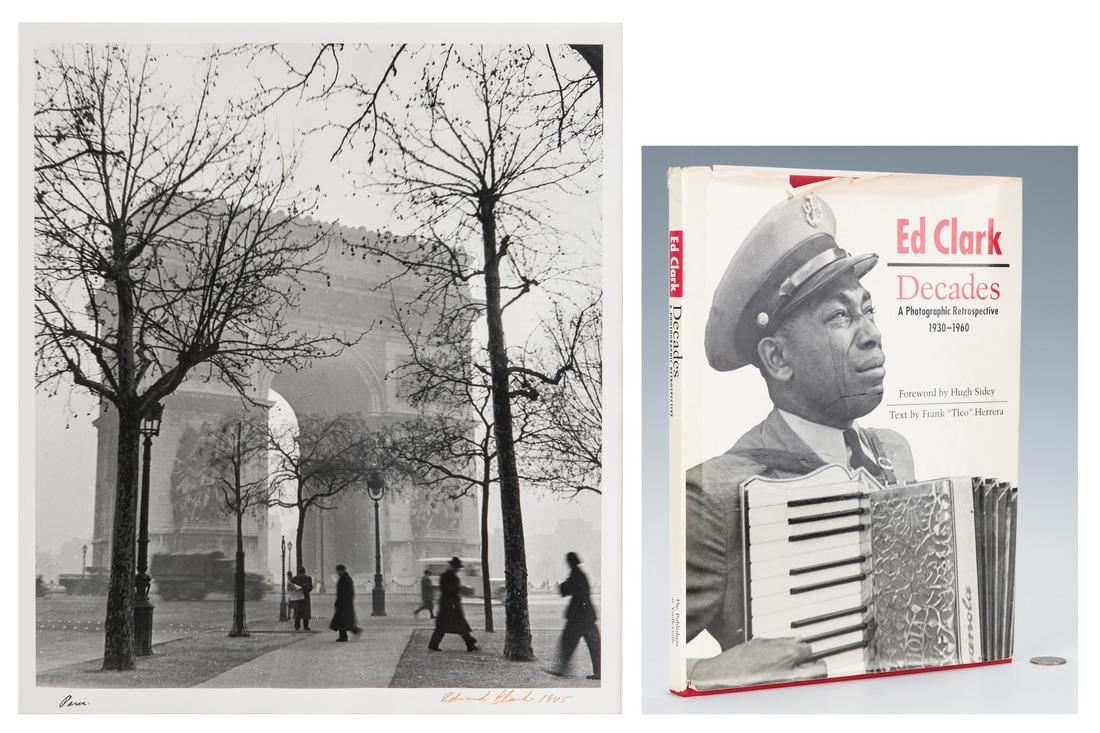 Signed Ed Clark Paris Photo and book: Edward Clark (American/Tennessee, 1912-2000), black and white photograph of a World War II army vehicle passing by L'Arc de Triomphe in Paris; signed and dated Edward Clark 1945 lower right and titled